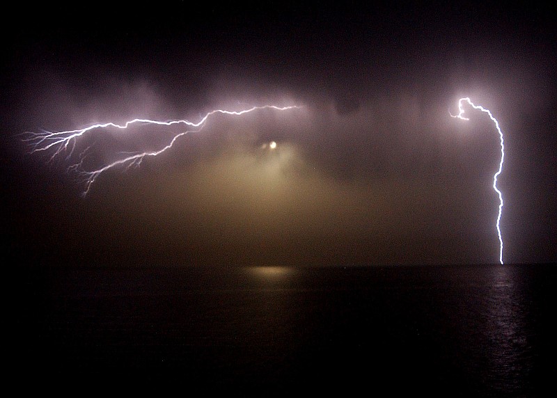 Lightning Bolts (Flashes) at Night as Seen From the Signal Bridge Aboard the United States Navy Aircraft Carrier USS George Washington (CVN 73), May 4, 2004, Arabian Gulf. Photo Credit: Photographer's Mate 3rd Class Lindsay Switzer, Navy NewsStand - Eye on the Fleet Photo Gallery (http://www.news.navy.mil/view_photos.asp, 040504-N-1280S-006), United States Navy (USN, http://www.navy.mil), United States Department of Defense (DoD, http://www.DefenseLink.mil or http://www.dod.gov), Government of the United States of America (USA).