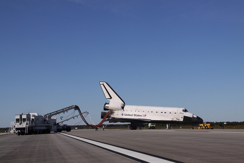 16. After A Picture Perfect Landing On Runway 33, Space Shuttle Atlantis (STS-129) Is Towed From the Shuttle Landing Facility to Orbiter Processing Facility-1 (OPF-1), November 27, 2009, NASA John F. Kennedy Space Center, State of Florida, USA. Photo Credit: Jack Pfaller, NASA; STS-129 Mission, Return of Space Shuttle Atlantis, November 27, 2009, Kennedy Media Gallery (http://mediaarchive.ksc.nasa.gov) Photo Number: KSC-2009-6626 (http://mediaarchive.ksc.nasa.gov/detail.cfm?mediaid=44533), John F. Kennedy Space Center (KSC, http://www.nasa.gov/centers/kennedy), National Aeronautics and Space Administration (NASA, http://www.nasa.gov), Government of the United States of America.