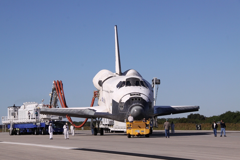 17. Another View of Space Shuttle Atlantis (STS-129) As the Orbiter Is Towed From the Shuttle Landing Facility to Orbiter Processing Facility-1 (OPF-1), November 27, 2009, NASA John F. Kennedy Space Center, State of Florida, USA. Photo Credit: Jack Pfaller, NASA; STS-129 Mission, Return of Space Shuttle Atlantis, November 27, 2009, Kennedy Media Gallery (http://mediaarchive.ksc.nasa.gov) Photo Number: KSC-2009-6626 (http://mediaarchive.ksc.nasa.gov/detail.cfm?mediaid=44533), John F. Kennedy Space Center (KSC, http://www.nasa.gov/centers/kennedy), National Aeronautics and Space Administration (NASA, http://www.nasa.gov), Government of the United States of America.