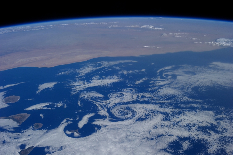 2. Clouds and Vortices Over the Atlantic Ocean As Seen From the International Space Station (Expedition 36) on July 6, 2013 at 17:28:27 GMT, Latitude (LAT): 29.6, Longitude (LON): -22.0, Altitude (ALT): 219 Nautical Miles, Sun Azimuth (AZI): 277 degrees, Sun Elevation Angle (ELEV): 37 degrees. Photo Credit: NASA; ISS036-E-16256, International Space Station (Expedition 36); Image Science and Analysis Laboratory, NASA-Johnson Space Center. 'The Gateway to Astronaut Photography of Earth.' <http://eol.jsc.nasa.gov/scripts/sseop/photo.pl?mission=ISS036&roll=E&frame=16256>; National Aeronautics and Space Administration (NASA, http://www.nasa.gov), Government of the United States of America (USA).