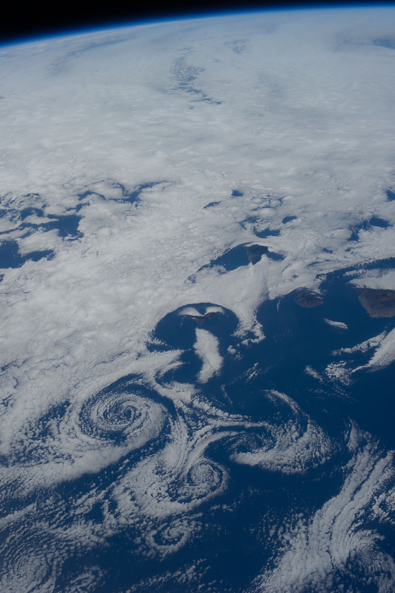 7. Clouds and Vortices Over the Atlantic Ocean As Seen From the International Space Station (Expedition 36) on July 6, 2013 at 17:30:55 GMT, Latitude (LAT): 22.6, Longitude (LON): -15.3, Altitude (ALT): 220 Nautical Miles, Sun Azimuth (AZI): 284 degrees, Sun Elevation Angle (ELEV): 29 degrees. Photo Credit: NASA; ISS036-E-16274, International Space Station (Expedition 36); Image Science and Analysis Laboratory, NASA-Johnson Space Center. 'The Gateway to Astronaut Photography of Earth.' <http://eol.jsc.nasa.gov/scripts/sseop/photo.pl?mission=ISS036&roll=E&frame=16274>; National Aeronautics and Space Administration (NASA, http://www.nasa.gov), Government of the United States of America (USA).