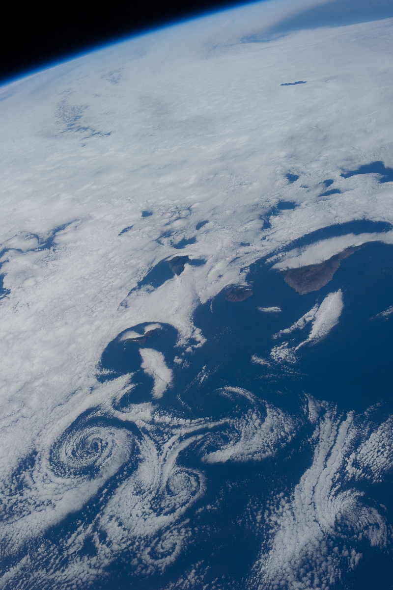 8. Clouds and Vortices Over the Atlantic Ocean As Seen From the International Space Station (Expedition 36) on July 6, 2013 at 17:30:57 GMT, Latitude (LAT): 22.5, Longitude (LON): -15.2, Altitude (ALT): 220 Nautical Miles, Sun Azimuth (AZI): 284 degrees, Sun Elevation Angle (ELEV): 29 degrees. Photo Credit: NASA; ISS036-E-16275, International Space Station (Expedition 36); Image Science and Analysis Laboratory, NASA-Johnson Space Center. 'The Gateway to Astronaut Photography of Earth.' <http://eol.jsc.nasa.gov/scripts/sseop/photo.pl?mission=ISS036&roll=E&frame=16275>; National Aeronautics and Space Administration (NASA, http://www.nasa.gov), Government of the United States of America (USA).