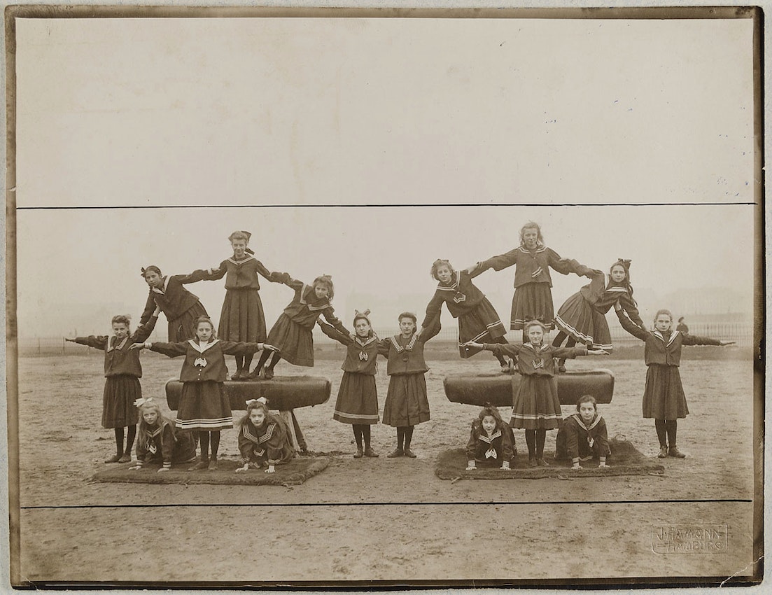 photograph of girls forming a pyramid