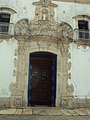 "Detalhe_portal_da_Igreja_Matriz_Nossa_Senhora_da_Conceição,_Prados_MG.jpg" by User:Friduxa