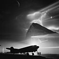 80 Douglas DC-3 of BOAC at Gibraltar, silhouetted by searchlights on the Rock uploaded by Dc3gibraltar, nominated by Dura-Ace