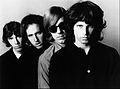 Acid rock group The Doors with controversial lead singer Jim Morrison who was also known as "The Lizard King".