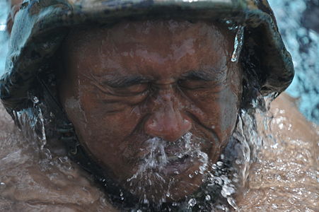 Indonesian Marine blows water out of his nose.