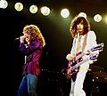 "Jimmy_Page_with_Robert_Plant_2_-_Led_Zeppelin_-_1977.jpg" by User:WikiJunkie