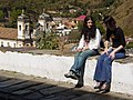 "Young_Women_Chat_on_the_Street_-_Ouro_Preto_-_Minas_Gerais_-_Brazil.jpg" by User:Adam63