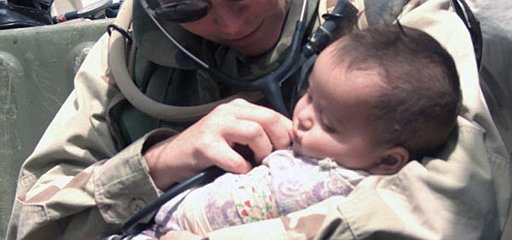 4. Securely and comfortably nestled in the arm of Hospital Corpsman 1st Class Maureen Smith, a cute and calm Iraqi baby is examined during a humanitarian visit to an Iraqi village, April 8, 2003. Al Jumhuriyah al Iraqiyah - Republic of Iraq. Photo Credit: Lance Cpl. Alicia M. Anderson of the United States Marine Corps (http://www.usmc.mil), Navy NewsStand - Eye on the Fleet Photo Gallery (http://www.news.navy.mil/view_photos.asp, 030408-M-5607A-013), United States Navy (USN, http://www.navy.mil), United States Department of Defense (DoD, http://www.DefenseLink.mil or http://www.dod.gov), Government of the United States of America (USA).