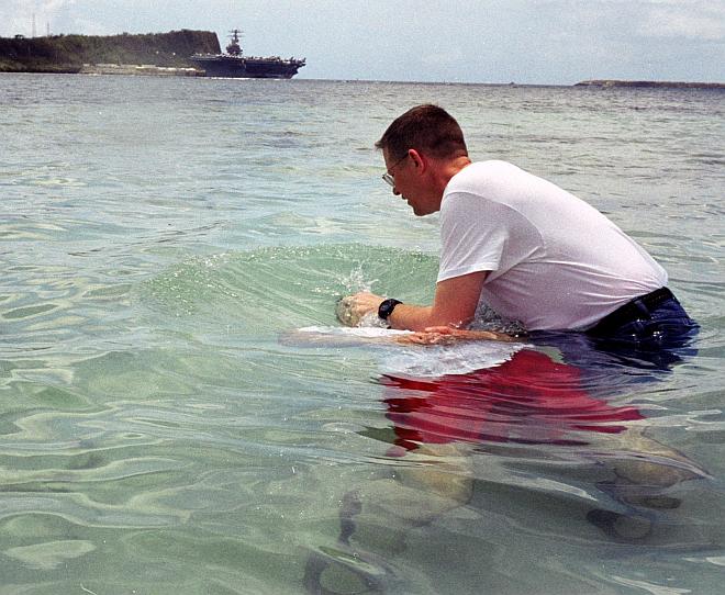 Baptism by Immersion in the Flowing Waters of the Philippine Sea on Easter Sunday, April 20, 2003. Apra Harbor, Territory of Guam, USA. Photo Credit: Lt. Cmdr. Bob Meeker, Navy NewsStand - Eye on the Fleet Photo Gallery (http://www.news.navy.mil/view_photos.asp, 030420-N-9236M-025), United States Navy (USN, http://www.navy.mil), United States Department of Defense (DoD, http://www.DefenseLink.mil or http://www.dod.gov), Government of the United States of America (USA).