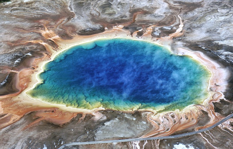 1. From 1973, an Aerial View of the Grand Prismatic Spring, Midway Geyser Basin, Yellowstone National Park, State of Wyoming, USA. Photo Credit: NPS Photo, A. Mebane, 1973. Yellowstone National Park Geothermal Feature Images for Publication (http://www.nps.gov/yell/press/images/thermalf/index.htm), Yellowstone National Park (http://www.nps.gov/yell), National Park Service (NPS, http://www.nps.gov), United States Department of the Interior (http://www.doi.gov), Government of the United States of America (USA).