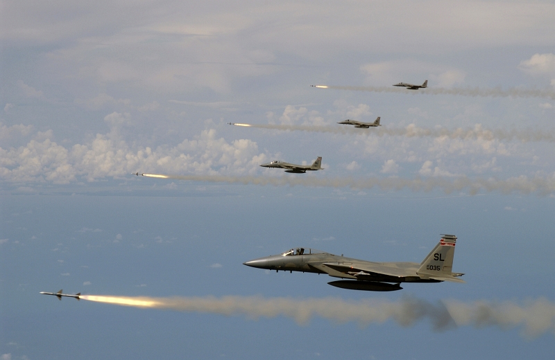 7. Four F-15 Eagle Fighter Jets, Assigned to the Missouri Air National Guard 110th Fighter Squadron, Simultaneously Fire AIM-7 Sparrow Radar-Guided Air-to-Air Missiles At a Target Drone During the U.S. Air Force's Weapons System Evaluation Program (WSEP) known as 'Combat Archer', July 15, 2005, Gulf of Mexico, USA. Photo Credit: Master Sgt. Michael Ammons, United States Air Force; Defense Visual Information (DVI, http://www.DefenseImagery.mil, 050715-F-7709A-003 and DF-SD-08-03403) and United States Air Force (USAF, http://www.af.mil), United States Department of Defense (DoD, http://www.DefenseLink.mil or http://www.dod.gov), Government of the United States of America (USA).