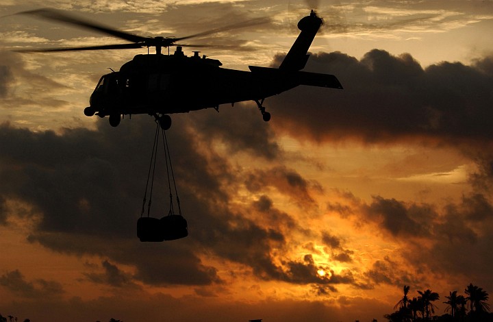 Lungi, Republic of Sierra Leone, August 27, 2003: What a Beautiful Sunset! Also Visible is an HH-60G Pave Hawk Helicopter With the 56th Rescue Squadron, Naval Air Station Keflavik, Iceland. Photo Credit: Tech. Sgt. Justin D. Pyle, Air Force Link - Week in Photos, September 5, 2003 (http://www.af.mil/weekinphotos/030905-04.html, "Into the setting sun"), United States Air Force (USAF, http://www.af.mil), United States Department of Defense (DoD, http://www.DefenseLink.mil or http://www.dod.gov), Government of the United States of America (USA).
