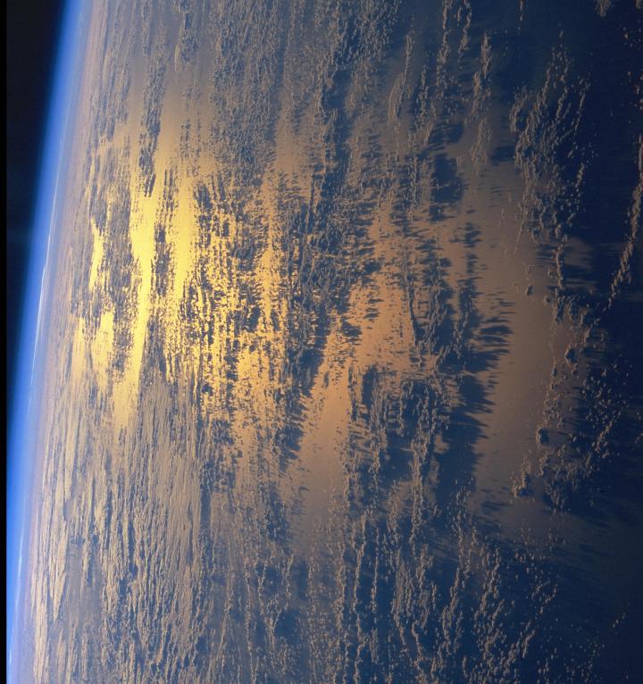 Space Shuttle Columbia (STS-93), July 25, 1999, 08:09:51 UTC: Planet Earth's Beautiful Golden Sunset With Low Clouds and Their Shadows Off the Eastern Coast of Republica Federativa do Brasil - Federative Republic of Brazil in the Western South Atlantic Ocean. Photo Credit: NASA's Space Shuttle Columbia: STS-93 Mission; NASA-Johnson Space Center. 'Astronaut Photography of Earth - Display Record.' <http://eol.jsc.nasa.gov/scripts/sseop/photo.pl?mission=STS093&roll=708&frame=37>; National Aeronautics and Space Administration (NASA, http://www.nasa.gov), Government of the United States of America (USA). The photo's full size request URL is <http://eol.jsc.nasa.gov/scripts/sseop/LargeImageAccess.pl?directory=ISD/highres/STS093&filename=STS093-708-37_4.JPG&filesize=2116094>