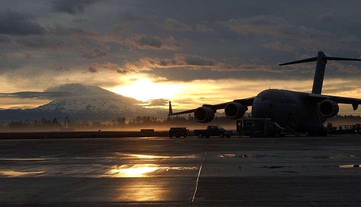 Early in the Morning: Sunrise Over Mt. Rainier and McChord Air Force Base, State of Washington, USA. Photo Credit: Kristin Royalty, 62 Communications Squadron, McChord AFB; Air Force Link - Week in Photos, January 28, 2005 (http://www.af.mil/weekinphotos/050128-01.html, 050119-F-1601R-001, "In the dawns early light"), United States Air Force (USAF, http://www.af.mil), United States Department of Defense (DoD, http://www.DefenseLink.mil or http://www.dod.gov), Government of the United States of America (USA).