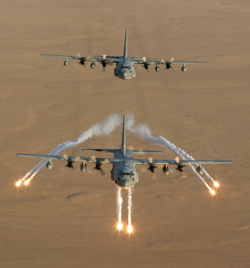 1. Aerial View of United States Marine Corps KC-130 Hercules Aircraft, Assigned to Marine Aerial Refueler-Transport Squadron Two Thirty Four (VMGR-234), As It Fires Flares That Are Used as a Defense Against Attacks by Surface to Air Missiles (SAMs or SAM) During Operation Iraqi Freedom, September 4, 2003, Al Jumhuriyah al Iraqiyah - Republic of Iraq. Photo Credit: Lance Corporal Andrew Z. Williams, United States Marine Corps (USMC, http://www.usmc.mil); September 4, 2003 Collection, Image ID: 030904-M-7837W-011, 2003 Image Gallery (http://www.tecom.usmc.mil/ccm/imu/galleries/MarForRes/03%20Submissions/Sept/Sept_03.htm), MARFORRES Galleries (http://www.tecom.usmc.mil/ccm/imu/pages/Galleries/MARFORRES.htm), Marine Corps Combat Camera Management and Imagery Management Unit - Photo: Command Submissions (http://www.tecom.usmc.mil/ccm/IMU/pages/photo.htm), Marine Corps Combat Camera Management and Imagery Management Unit (http://www.tecom.usmc.mil/ccm/IMU/IMU.htm), USMC Training And Education Command (TECOM, http://www.tecom.usmc.mil), United States Marine Corps (USMC, http://www.usmc.mil); United States Department of Defense (DoD, http://www.DefenseLink.mil or http://www.dod.gov), Government of the United States of America (USA). See also ChamorroBible.org: Manguaguan na Palabran Si Yuus, Fagualo (Octubre) 10, 2004 <http://ChamorroBible.org/gpw/gpw-20041010.htm>.