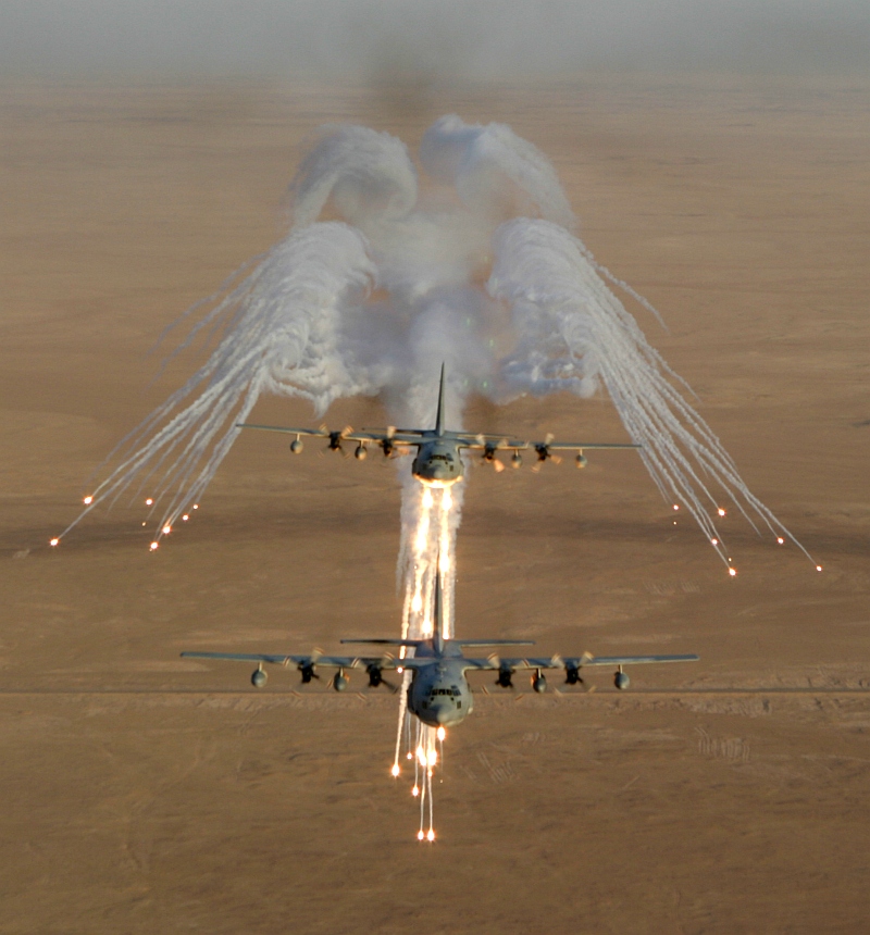 3. Another Aerial View of United States Marine Corps KC-130 Hercules Aircraft, Assigned to Marine Aerial Refueler-Transport Squadron Two Thirty Four (VMGR-234), As It Fires Flares Used to Counter an Attack by Surface to Air Missiles (SAMs or SAM) During Operation Iraqi Freedom, September 4, 2003, Al Jumhuriyah al Iraqiyah - Republic of Iraq. Photo Credit: Lance Cpl. Andrew Z. Williams, United States Marine Corps (USMC, http://www.usmc.mil); September 4, 2003 Collection, Image ID: 030904-M-7837W-011, 2003 Image Gallery (http://www.tecom.usmc.mil/ccm/imu/galleries/MarForRes/03%20Submissions/Sept/Sept_03.htm), MARFORRES Galleries (http://www.tecom.usmc.mil/ccm/imu/pages/Galleries/MARFORRES.htm), Marine Corps Combat Camera Management and Imagery Management Unit - Photo: Command Submissions (http://www.tecom.usmc.mil/ccm/IMU/pages/photo.htm), Marine Corps Combat Camera Management and Imagery Management Unit (http://www.tecom.usmc.mil/ccm/IMU/IMU.htm), USMC Training And Education Command (TECOM, http://www.tecom.usmc.mil), United States Marine Corps (USMC, http://www.usmc.mil); United States Department of Defense (DoD, http://www.DefenseLink.mil or http://www.dod.gov), Government of the United States of America (USA). See also ChamorroBible.org: Manguaguan na Palabran Si Yuus, Fagualo (Octubre) 10, 2004 <http://ChamorroBible.org/gpw/gpw-20041010.htm>.