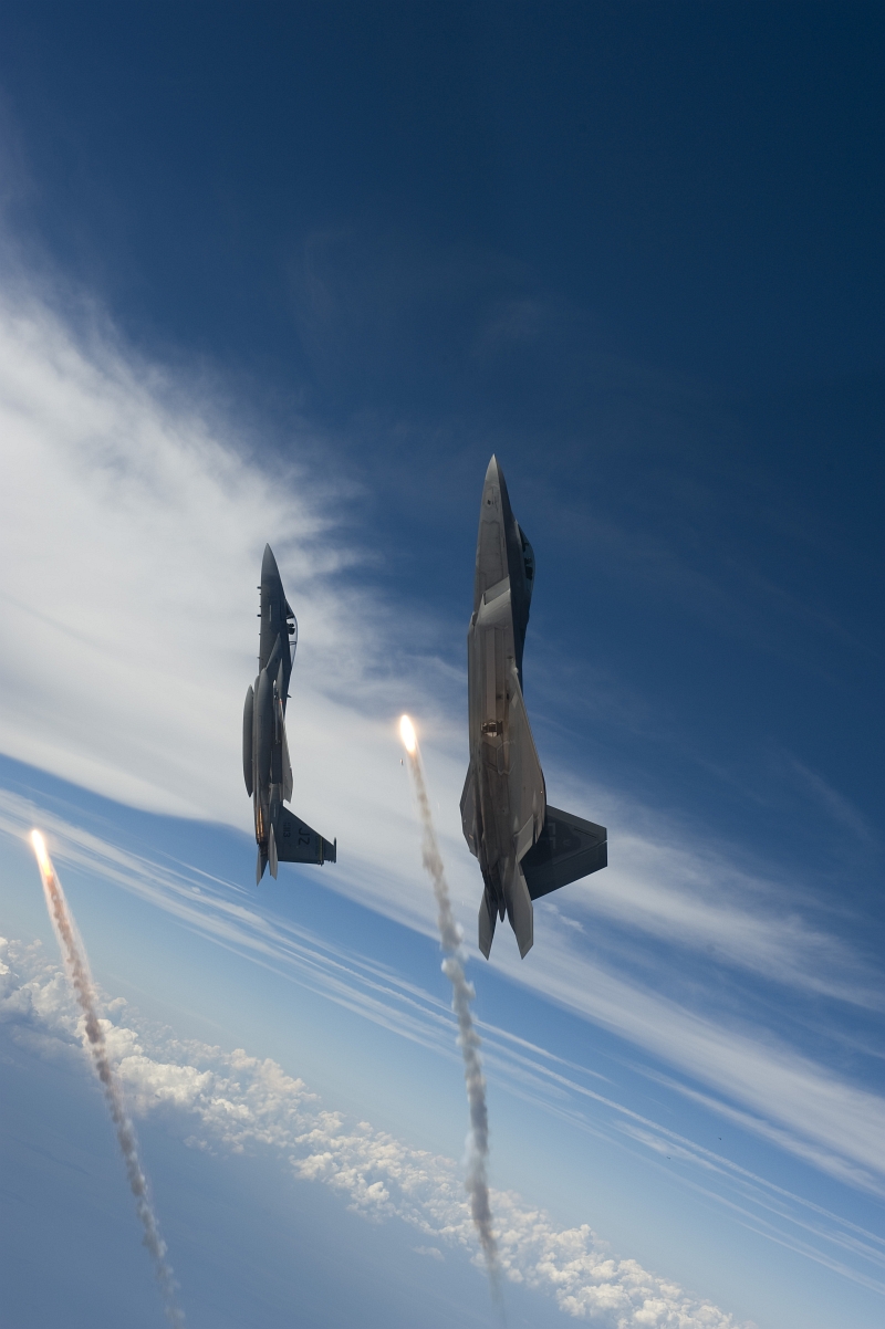 8. Going Vertical, One U.S. Air Force F-22A Raptor Stealth Fighter Jet and One U.S. Air Force F-15 Eagle Fighter Jet Each Fire One Flare While Over the Gulf of Mexico, August 27, 2008, New Orleans Naval Air Station, State of Louisiana, USA. Photo Credit: Staff Sgt. James L. Harper Jr., United States Air Force; Defense Visual Information (DVI, http://www.DefenseImagery.mil, 080827-F-4177H-103 and 080827-F-OK231-103) and United States Air Force (USAF, http://www.af.mil), United States Department of Defense (DoD, http://www.DefenseLink.mil or http://www.dod.gov), Government of the United States of America (USA).