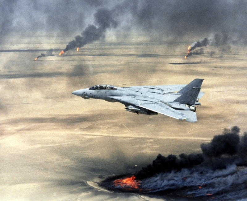 7. A U.S. Navy F-14A Tomcat Fighter Jet Flies Over Burning Oil Wells During Operation Desert Storm, February 1, 1991, Dawlat al Kuwayt - State of Kuwait. Photo Credit: Defense Visual Information (DVI, http://www.DefenseImagery.mil, DN-SC-04-15221) and United States Navy (USN, http://www.navy.mil), United States Department of Defense (DoD, http://www.DefenseLink.mil or http://www.dod.gov), Government of the United States of America (USA).