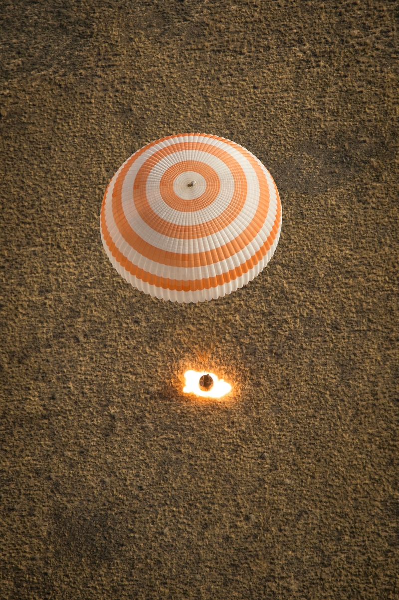 42. Parachute Fully Deployed and Retrograde Rockets (Retro-Rockets) Ignited, Russian Federation's Soyuz TMA-08M Spacecraft Lands In A Remote Area Near the Town of Zhezkazgan, September 11, 2013, Qazaqstan Respublikasy - Republic of Kazakhstan. Photo Credit: Bill Ingalls, NASA; 201309110001hq, 'Expedition 36 Soyuz Landing' (http://www.nasa.gov/content/expedition-36-soyuz-landing/), National Aeronautics and Space Administration (NASA, http://www.nasa.gov), Government of the United States of America.