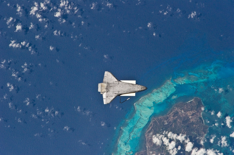 3. The Underside (Belly) of Space Shuttle Discovery (STS-131), April 17, 2010, As Seen From the International Space Station (Expedition Twenty-Three) While Orbiting Above the Caribbean Sea and Near Colombia's Isla de Providencia. Photo Credit: STS-131 Shuttle Mission Imagery (http://spaceflight.nasa.gov/gallery/images/shuttle/sts-131/ndxpage1.html), ISS023-E-025405 (http://spaceflight.nasa.gov/gallery/images/shuttle/sts-131/html/iss023e025405.html), NASA Human Space Flight (http://spaceflight.nasa.gov), National Aeronautics and Space Administration (NASA, http://www.nasa.gov), Government of the United States of America. Additional details from NASA: 'The recognizable feature on Earth below is the south end of Isla de Providencia, about 150 miles off the coast of Nicaragua near 13.3 degrees north latitude 81.4 degrees west longitude. The island belongs to Colombia.'