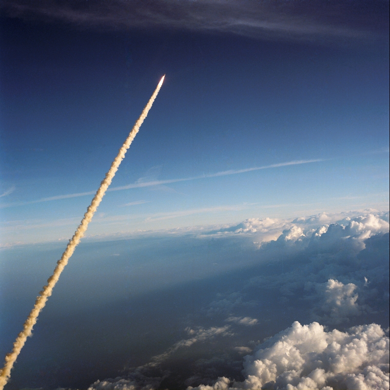 19. Space Shuttle Challenger (STS-41B) Rising High Above Cloudy Earth, February 3, 1984. Photo Credit: National Aeronautics and Space Administration (NASA, http://www.nasa.gov), Government of the United States of America (USA).