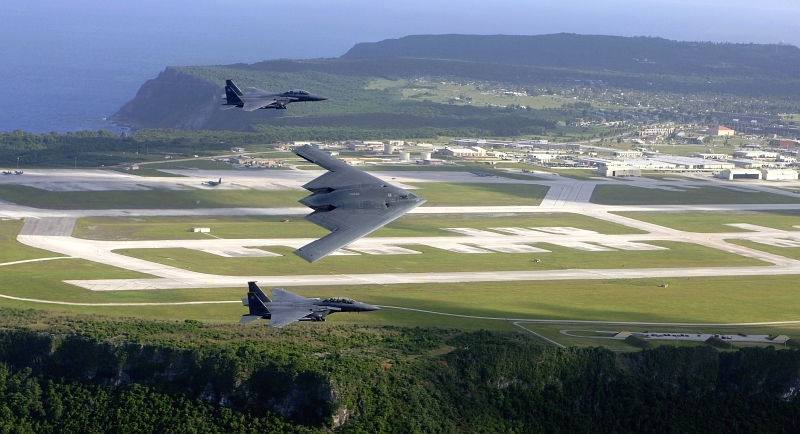 30. Two U.S. Air Force F-15E Strike Eagle Fighter Jets and One U.S. Air Force B-2 Spirit Stealth Bomber Fly In Formation Over Andersen Air Force Base, July 5, 2005, Territory of Guam, USA. Photo Credit: Tech. Sgt. Cecilio M. Ricardo, United States Air Force; Defense Visual Information (DVI, http://www.DefenseImagery.mil, 050705-F-MJ260-001 or DF-SD-08-19937) and United States Air Force (USAF, http://www.af.mil), United States Department of Defense (DoD, http://www.DefenseLink.mil or http://www.dod.gov), Government of the United States of America (USA).