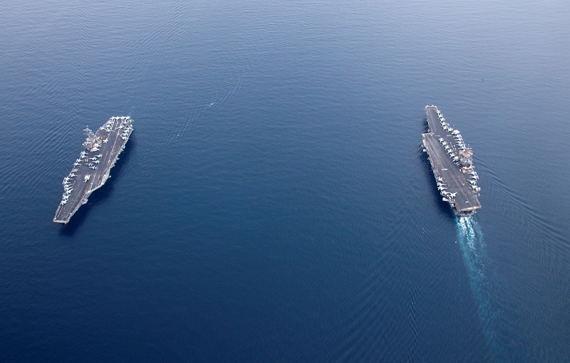 36. United States Navy Aircraft Carriers In the Strait of Bab el-Mandeb (Bab el Mandeb): The USS Enterprise (CVN 65), On the Right, Passes the USS George H.W. Bush (CVN 77), On the Left, June 21, 2011, Red Sea. Photo Credit: Mass Communication Specialist 2nd Class Brooks B. Patton Jr., United States Navy; Defense Visual Information (DVI, http://www.DefenseImagery.mil, 110621-N-JL826-001) and United States Navy (USN, http://www.navy.mil), United States Department of Defense (DoD, http://www.DefenseLink.mil or http://www.dod.gov), Government of the United States of America (USA).