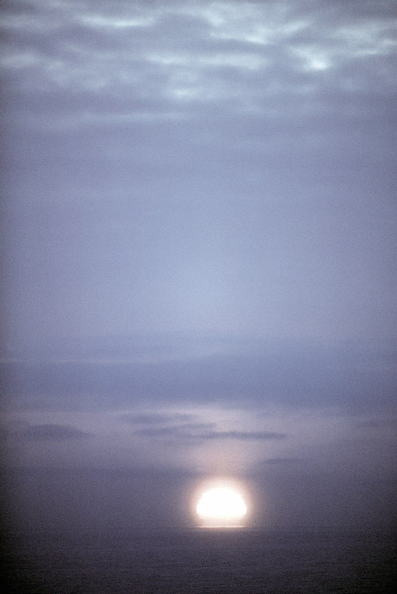 6. Sunset, March 8, 1982, Kotzebue Air Station, State of Alaska, USA. Photo Credit: Staff Sgt. Bill Thompson; Defense Visual Information Center (DVIC, http://www.DoDMedia.osd.mil, DFST8300332), United States Department of Defense (DoD, http://www.DefenseLink.mil or http://www.dod.gov), Government of the United States of America (USA).