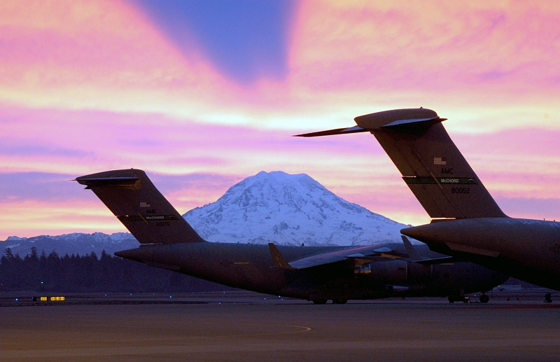9. The Sunrise Over Mount Rainier Casts a Shadow of the Mountain On the Clouds Above, December 30, 2003, McChord Air Force Base, State of Washington, USA. Photo Credit: Kevin J. Tosh, CIV, United States Air Force (USAF, http://www.af.mil); Defense Visual Information Center (DVIC, http://www.DoDMedia.osd.mil, DFSD0602890 and 031230F0158T001) and United States Air Force (USAF, http://www.af.mil), United States Department of Defense (DoD, http://www.DefenseLink.mil or http://www.dod.gov), Government of the United States of America (USA).