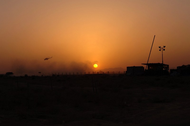 26. Sunrise at Kandahar Airfield, September 15, 2005, Jomhuri-ye Eslami-ye Afghanestan - Islamic Republic of Afghanistan. Photo Credit: Sgt. Andre Reynolds, United States Air Force (USAF, http://www.af.mil); Defense Visual Information Center (DVIC, http://www.DoDMedia.osd.mil, DASD0604000 and 050915A5679R001) and United States Air Force (USAF, http://www.af.mil), United States Department of Defense (DoD, http://www.DefenseLink.mil or http://www.dod.gov), Government of the United States of America (USA).