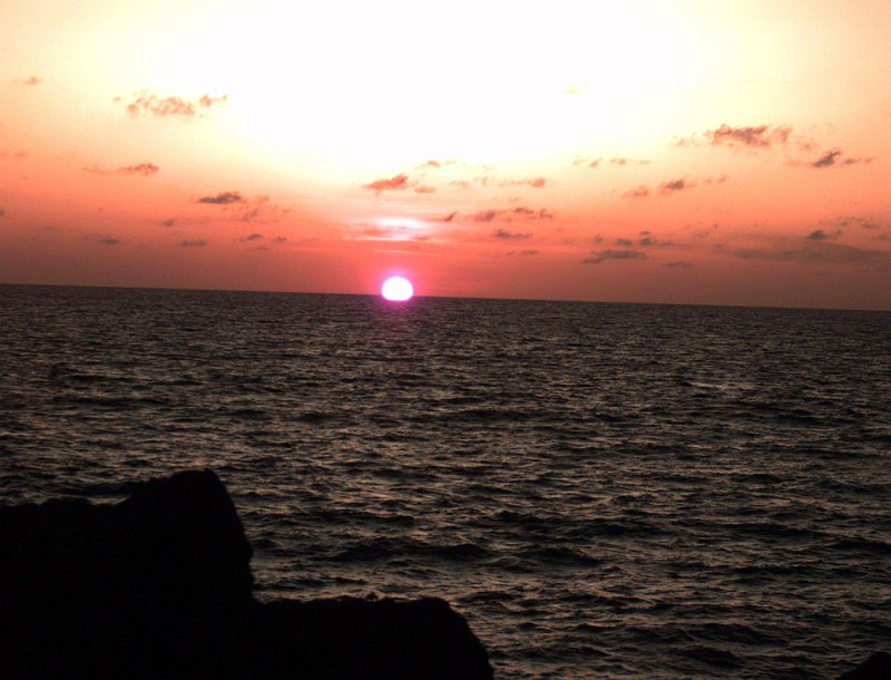31. In This Lovely Sunrise, the Sun Appears to Rise From Beneath the Indian Ocean, December 24, 1992, Off the coast of Kismayo, Jamhuuriyada Demuqraadiga Soomaaliyeed - Somalia. Photo Credit: Sgt. Dan Hart; Defense Visual Information Center (DVIC, http://www.DoDMedia.osd.mil, DASD9702545 and J3301DSP92000010), United States Department of Defense (DoD, http://www.DefenseLink.mil or http://www.dod.gov), Government of the United States of America (USA).