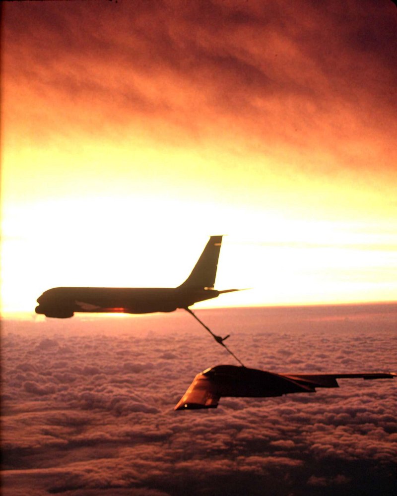 33. A Sunset -- A Dazzlingly Bright Wall of Light, Brilliantly Painted In White and Yellow and Orange Hues (Colors) -- Above the Clouds, December 2, 2002. Photo Credit: Senior Master Sergeant (SMSgt.) Rose Reynolds, Air Force Link - Photos (http://www.af.mil/photos, 030202-F-0193C-004, "Sunset refueling"), United States Air Force (USAF, http://www.af.mil), United States Department of Defense (DoD, http://www.DefenseLink.mil or http://www.dod.gov), Government of the United States of America (USA).