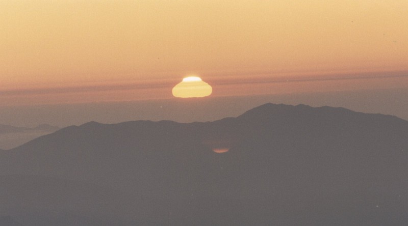 40. Sunset, Cerro Tololo, Republica de Chile - Republic of Chile. Photo Credit: CTIO (Cerro Tololo Inter-American Observatory, http://www.ctio.noao.edu) at night: Sunset at Cerro Tololo, Chile. Close to the horizon often anomal refractions distort the image of a rising and setting object (http://ad.usno.navy.mil/ucac/pic_night.html). United States Naval Observatory (USNO) CCD Astrograph Catalog (UCAC, http://ad.usno.navy.mil/ucac), Astrometry Department of the U.S. Naval Observatory (http://ad.usno.navy.mil), United States Navy (USN, http://www.navy.mil), United States Department of Defense (DoD, http://www.DefenseLink.mil or http://www.dod.gov), Government of the United States of America (USA).
