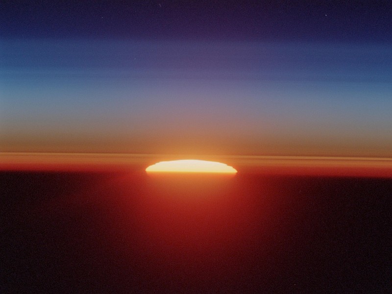 48. Sunset Over the Sahara Desert, June 18, 2002, As Seen Through Earth's Atmospheric Limb From Space Shuttle Endeavour (STS-111) While Over Sudan Near the Red Sea Coast. Photo Credit: STS111-321-24, Atmospheric limb, Sunset, Sahara Desert, Space Shuttle Endeavour (STS-111) over Sudan near the Red Sea coast; Image Science and Analysis Laboratory, NASA-Johnson Space Center. ' Astronaut Photography of Earth - Display Record.' <http://eol.jsc.nasa.gov/scripts/sseop/photo.pl?mission=STS111&roll=321&frame=24>; National Aeronautics and Space Administration (NASA, http://www.nasa.gov), Government of the United States of America (USA).