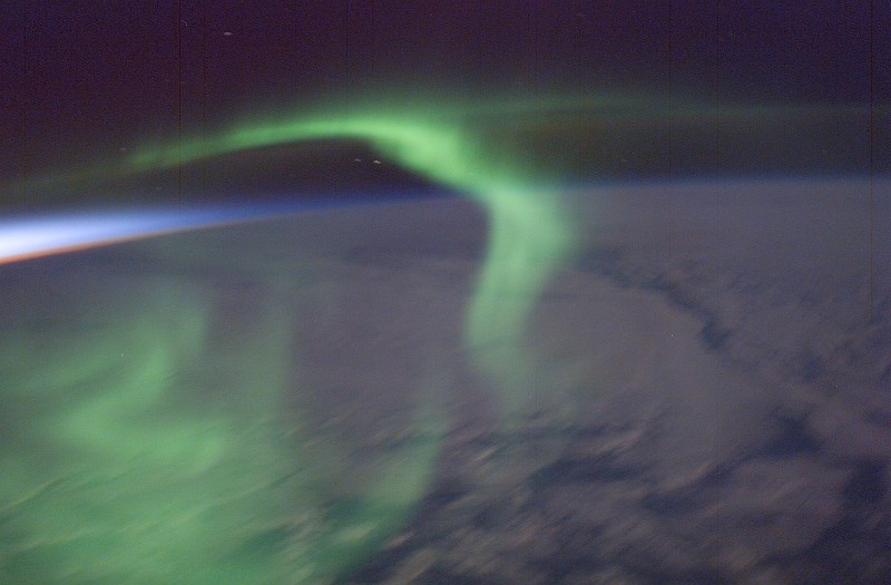 50. Sunset Colors on the Left (West) and the Delicate Green Aurora Australis Gracefully Swirling  Above Earth's Night Side As Seen From the International Space Station (Expedition 6) on February 16, 2003. Photo Credit: ISS006-E-28961, Sunset colors to the west, Earth's night side, Aurora Australis, International Space Station (Expedition Six); Image Science and Analysis Laboratory, NASA-Johnson Space Center. 'Astronaut Photography of Earth - Display Record.' <http://eol.jsc.nasa.gov/scripts/sseop/photo.pl?mission=ISS006&roll=E&frame=28961>; National Aeronautics and Space Administration (NASA, http://www.nasa.gov), Government of the United States of America (USA).