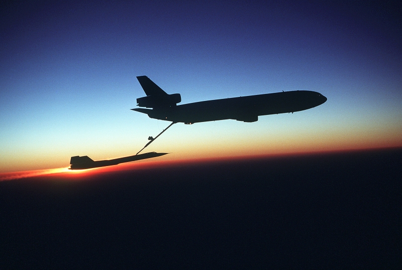 58. USAF KC-10 Extender Aircraft Refuels a USAF SR-71 Blackbird Aircraft During the Setting of the Sun, August 2, 1981, Beale Air Force Base, State of California, USA. Photo Credit: Staff Sgt. (SSGT) Bill Thompson, United States Air Force (USAF, http://www.af.mil); Defense Visual Information Center (DVIC, http://www.DoDMedia.osd.mil, DF-ST-83-03355) and United States Air Force (USAF, http://www.af.mil), United States Department of Defense (DoD, http://www.DefenseLink.mil or http://www.dod.gov), Government of the United States of America (USA).