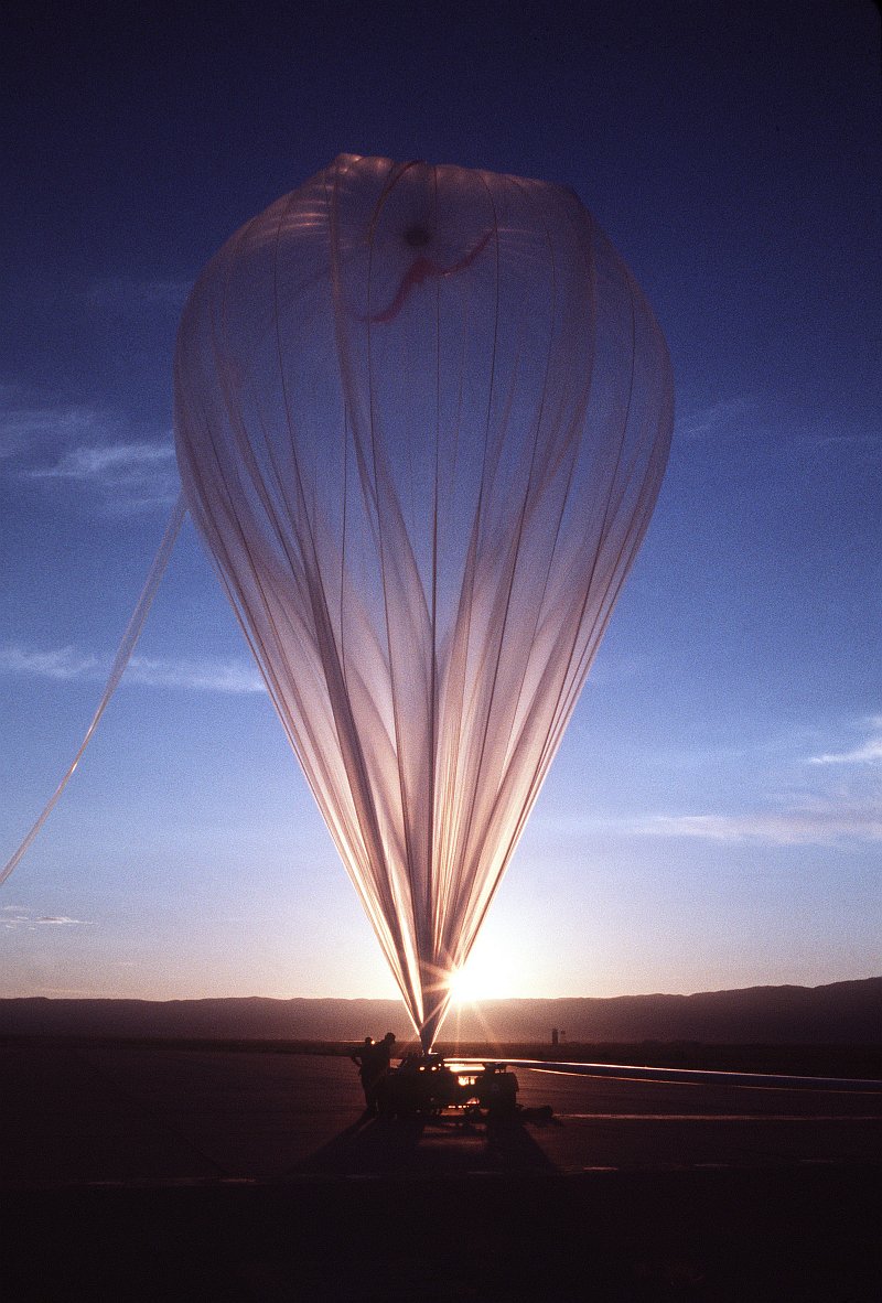 59. Preparing to Release an Enormous, Helium-Filled Balloon at Sunrise, January 1, 1979, Tularosa Basin, State of New Mexico, USA. Photo Credit: Master Sgt. (MSGT) Paul Harrington, United States Air Force (USAF, http://www.af.mil); Defense Visual Information Center (DVIC, http://www.DoDMedia.osd.mil, DFST8207594) and United States Air Force (USAF, http://www.af.mil), United States Department of Defense (DoD, http://www.DefenseLink.mil or http://www.dod.gov), Government of the United States of America (USA).