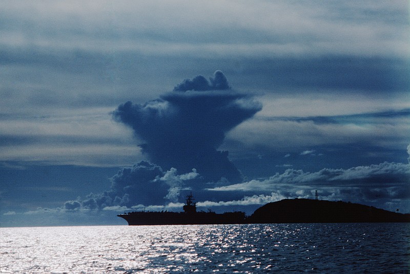 70. A Towering Cloud and the Anchored United States Navy Aircraft Carrier USS Dwight D. Eisenhower (CVN 69) at Dawn. Photo Credit: PH1 Rutschku, United States Navy (USN, http://www.navy.mil); Defense Visual Information Center (DVIC, http://www.DoDMedia.osd.mil, DNST8802028) and United States Navy (USN, http://www.navy.mil), United States Department of Defense (DoD, http://www.DefenseLink.mil or http://www.dod.gov), Government of the United States of America (USA).