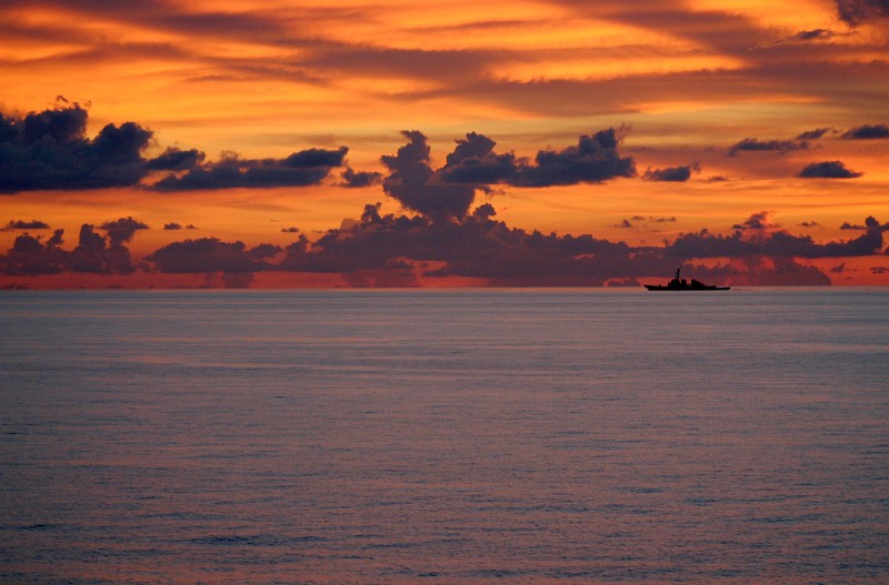 74. A Beautiful South China Sea Sunset, May 25, 2005. Photo Credit: Petty Officer 3rd Class (Journalist 3rd Class) David J. Ham, United States Navy (USN, http://www.navy.mil); 'DefendAmerica - U.S. Defense Dept. War on Terror: 05/27/2005 - Edition 5, SOUTH CHINA SEA' (http://www.DefendAmerica.mil/archive/2005-05/20050527pm2.html, http://www.DefendAmerica.mil), Photo ID: 050525-N-5663H-019, United States Department of Defense (DoD, http://www.DefenseLink.mil or http://www.dod.gov), Government of the United States of America (USA).