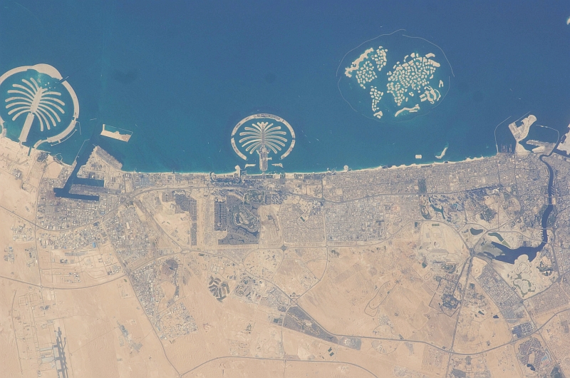 8. Palm Jebel Ali (Left), Palm Jumeirah (Center), and The World (Right), March 20, 2009 at 12:39:58 GMT, Dubai, Al Imarat al Arabiyah al Muttahidah - United Arab Emirates. As Seen From the International Space Station (Expedition 18), Latitude (LAT): 25.5, Longitude (LON): 55.1, Altitude (ALT): 191 Nautical Miles, Sun Azimuth (AZI): 258 degrees, Sun Elevation Angle (ELEV): 24 degrees. Photo Credit: NASA, International Space Station (Expedition Eighteen); ISS018-E-41939, Palm Jebel Ali and Palm Jumeirah (The Palm Islands), The World (World Islands), Dubai, United Arab Emirates; Image Science and Analysis Laboratory, NASA-Johnson Space Center. 'Astronaut Photography of Earth - Display Record.' <http://eol.jsc.nasa.gov/scripts/sseop/photo.pl?mission=ISS018&roll=E&frame=41939>; National Aeronautics and Space Administration (NASA, http://www.nasa.gov), Government of the United States of America (USA).