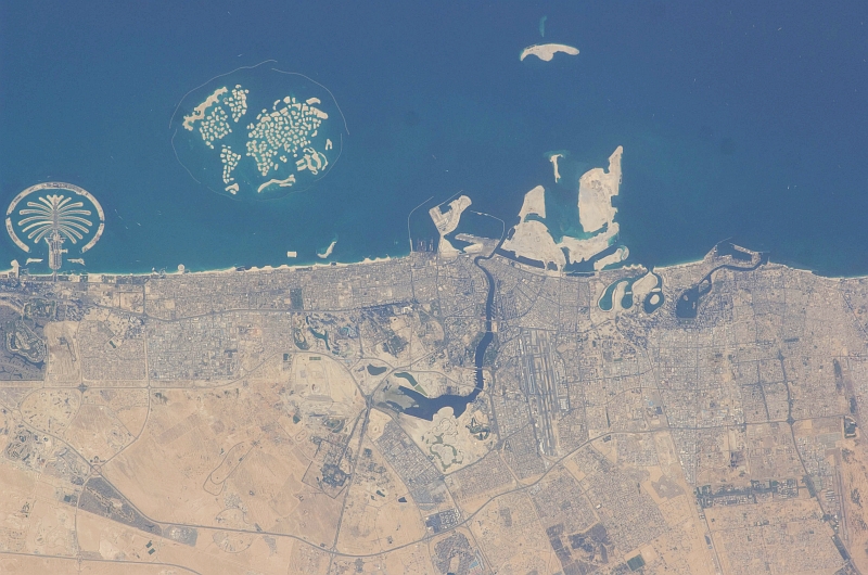7. Palm Jumeirah (Left) and The World (Right), March 20, 2009 at 12:39:59 GMT, Dubai, Al Imarat al Arabiyah al Muttahidah - United Arab Emirates, As Seen From the International Space Station (Expedition 18), Latitude (LAT): 25.6, Longitude (LON): 55.2, Altitude (ALT): 191 Nautical Miles, Sun Azimuth (AZI): 258 degrees, Sun Elevation Angle (ELEV): 24 degrees. Photo Credit: NASA, International Space Station (Expedition Eighteen); ISS018-E-41940, Palm Jumeirah (The Palm Islands), The World (World Islands); Image Science and Analysis Laboratory, NASA-Johnson Space Center. 'Astronaut Photography of Earth - Display Record.' <http://eol.jsc.nasa.gov/scripts/sseop/photo.pl?mission=ISS018&roll=E&frame=41940>; National Aeronautics and Space Administration (NASA, http://www.nasa.gov), Government of the United States of America (USA).