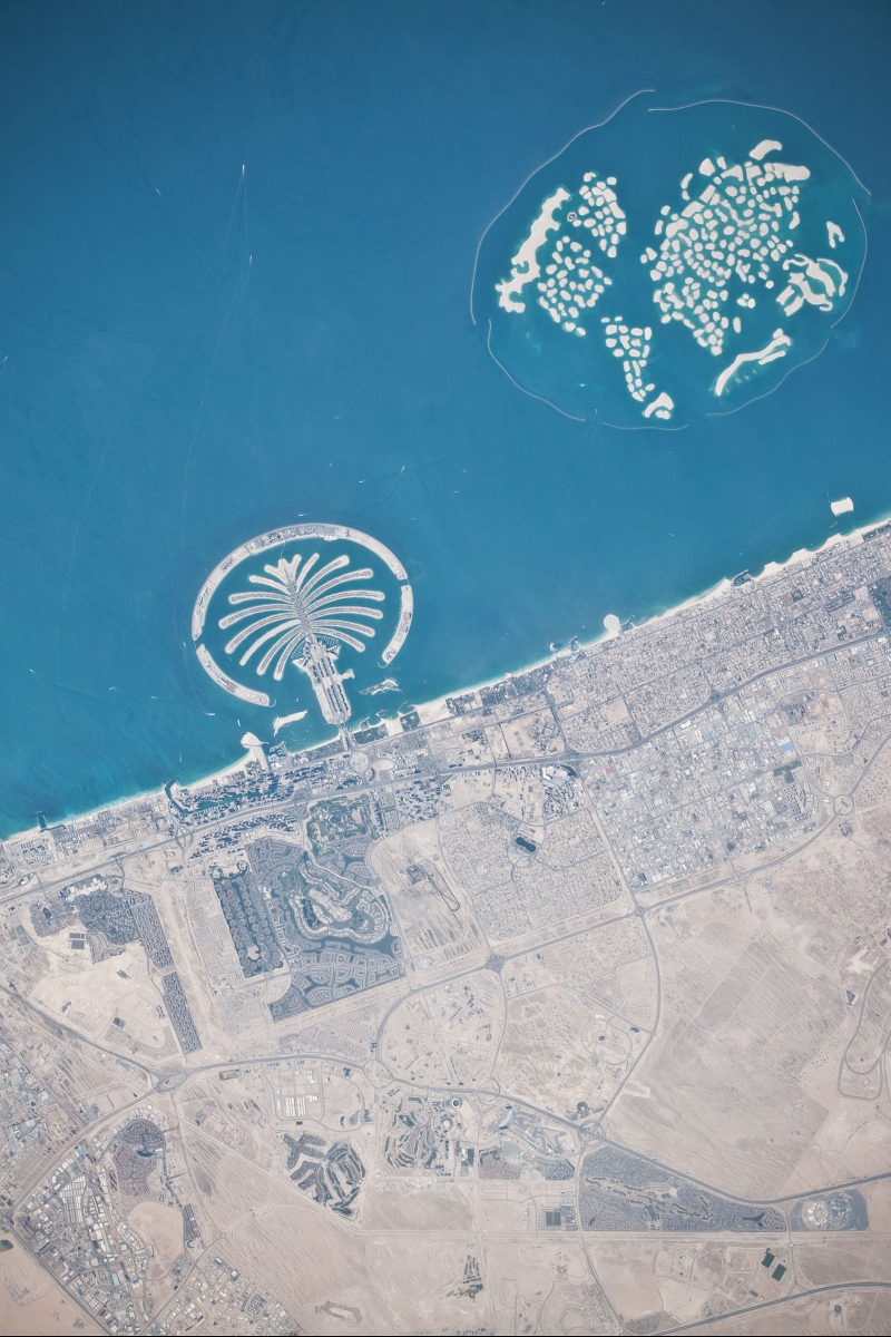 11. Palm Jumeirah and The World, March 13, 2010 at 10:32:48 GMT, Dubai, Al Imarat al Arabiyah al Muttahidah - United Arab Emirates, As Seen From the International Space Station (Expedition 22), Latitude (LAT): 26.2, Longitude (LON): 55.8, Altitude (ALT): 183 Nautical Miles, Sun Azimuth (AZI): 231 degrees, Sun Elevation Angle (ELEV): 48 degrees. Photo Credit: NASA, International Space Station (Expedition Twenty-Two), ISS022-E-101580; Image Science and Analysis Laboratory, NASA-Johnson Space Center. 'Astronaut Photography of Earth - Display Record.' <http://eol.jsc.nasa.gov/scripts/sseop/photo.pl?mission=ISS022&roll=E&frame=101578>; National Aeronautics and Space Administration (NASA, http://www.nasa.gov), Government of the United States of America (USA).