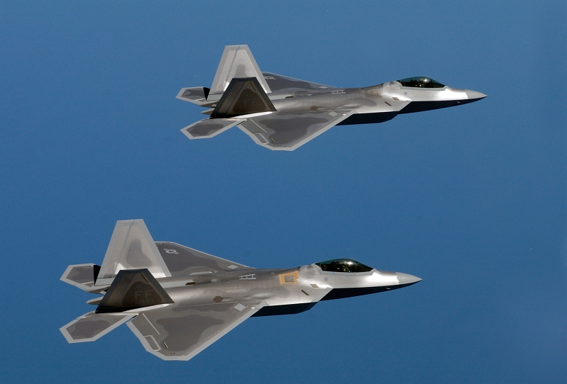 58. Two U.S. Air Force F-22A (F/A-22) Raptors Fly Over Langley Air Force Base, August 12, 2005, Commonwealth of Virginia, USA. Photo Credit: Tech. Sgt. Ben Bloker, United States Air Force; 050812-F-2295B-057; United States Air Force (USAF, http://www.af.mil), United States Department of Defense (DoD, http://www.DefenseLink.mil or http://www.dod.gov), Government of the United States of America (USA).