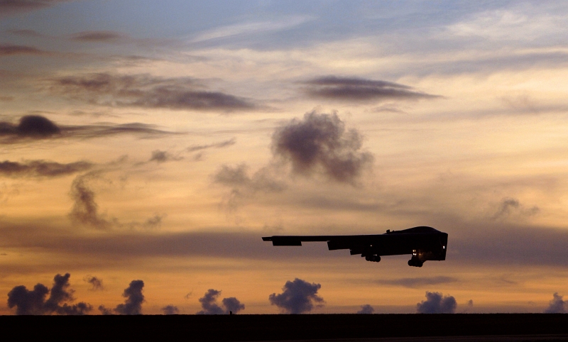 16. A U.S. Air Force B-2 Spirit Stealth Bomber Landing at Andersen Air Force Base (AFB) After A Long-Range Training Sortie Between Alaska and Guam, August 19, 2005, Territory of Guam, USA. Photo Credit: Staff Sgt. Bennie J. Davis III, United States Air Force; Defense Visual Information (DVI, http://www.DefenseImagery.mil, 050819-F-5040D-363 and DF-SD-08-20976) and United States Air Force (USAF, http://www.af.mil), United States Department of Defense (DoD, http://www.DefenseLink.mil or http://www.dod.gov), Government of the United States of America (USA).