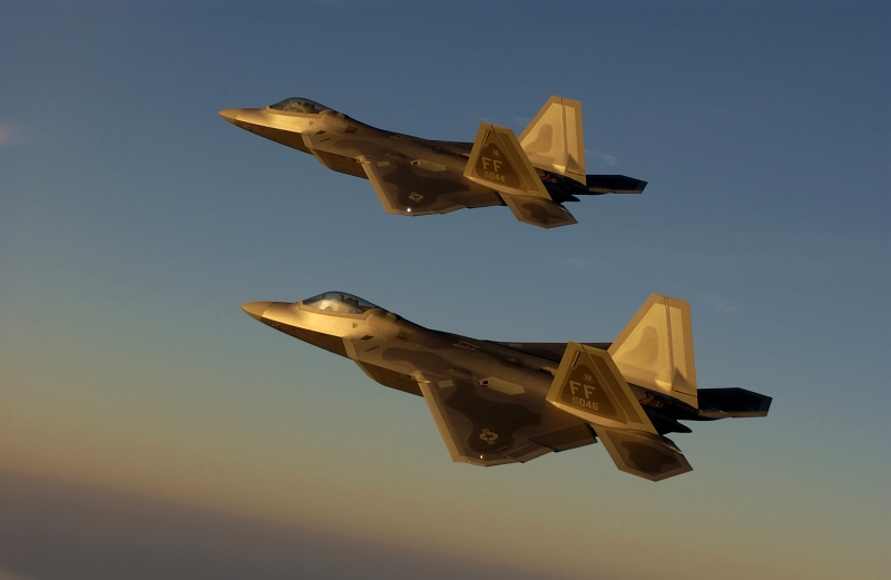 17. Bathed In Golden Sunlight, Two U.S. Air Force F-22A Raptor Fighter Jets Fly Over Langley Air Force Base, September 9, 2005, Commonwealth of Virginia, USA. Photo Credit: Technical Sgt. Ben Bloker, Air Force Link - Photos (http://www.af.mil/photos, 050909-F-2295B-095), United States Air Force (USAF, http://www.af.mil), United States Department of Defense (DoD, http://www.DefenseLink.mil or http://www.dod.gov), Government of the United States of America (USA).