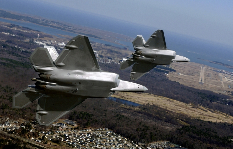 56. Delivering Two, New U.S. Air Force F-22A Raptor Stealth Fighter Jets to Langley Air Force Base (AFB), March 3, 2006, Commonwealth of Virginia, USA. Photo Credit: Tech. Sgt. Ben Bloker, United States Air Force; Defense Visual Information (DVI, http://www.DefenseImagery.mil, 060303-F-YL744-338, DF-SD-08-33417, and DFSD0833417) and United States Air Force (USAF, http://www.af.mil), United States Department of Defense (DoD, http://www.DefenseLink.mil or http://www.dod.gov), Government of the United States of America (USA).