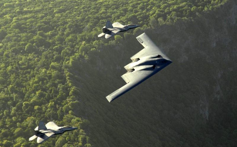 4. The B-2 Spirit and Two F-22A Raptor Fighters Fly In Formation Above the Cliffs, April 7, 2009, Territory of Guam, USA. Photo Credit: Master Sgt. Kevin J. Gruenwald, United States Air Force; Defense Visual Information (DVI, http://www.DefenseImagery.mil, 090414-F-6911G-004) and United States Air Force (USAF, http://www.af.mil), United States Department of Defense (DoD, http://www.DefenseLink.mil or http://www.dod.gov), Government of the United States of America (USA).