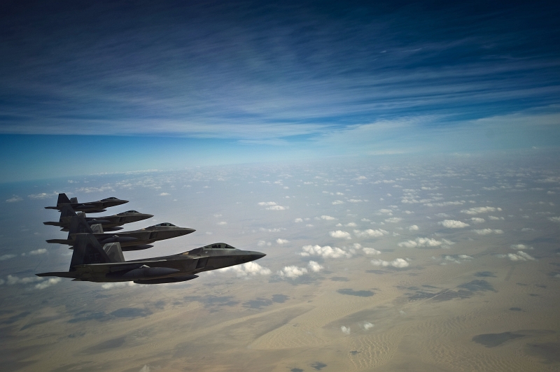 11. Four U.S. Air Force F-22A Raptor Stealth Fighter Jets (Deployed From the 27th Fighter Squadron at Langley Air Force Base in Virginia, USA) Fly In Formation Over Southwest Asia During A Training Mission at the Iron Falcon Exercise on December 9, 2009, United Arab Emirates - Al Imarat al Arabiyah al Muttahidah. Photo Credit: Staff Sgt. Michael B. Keller, United States Air Force; Defense Visual Information (DVI, http://www.DefenseImagery.mil, 091209-F-8155K-064) and United States Air Force (USAF, http://www.af.mil), United States Department of Defense (DoD, http://www.DefenseLink.mil or http://www.dod.gov), Government of the United States of America (USA).